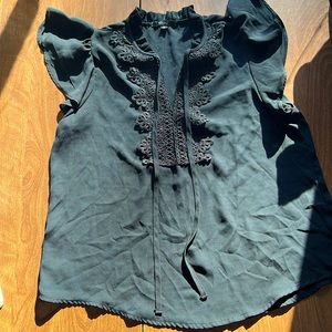 Black ruffled top with tie strings in front blashe